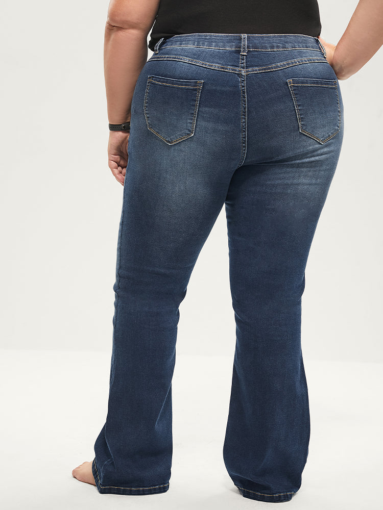 Jean bootcut à taille sculptante, très extensible, taille mi-haute, délavage moyen