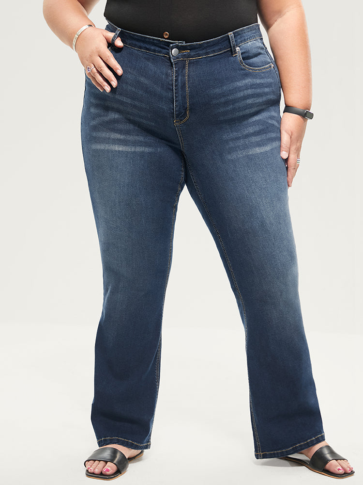 Jean bootcut à taille sculptante, très extensible, taille mi-haute, délavage moyen