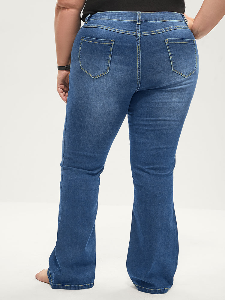 Jean bootcut à taille sculptante, très extensible, taille mi-haute, délavage moyen